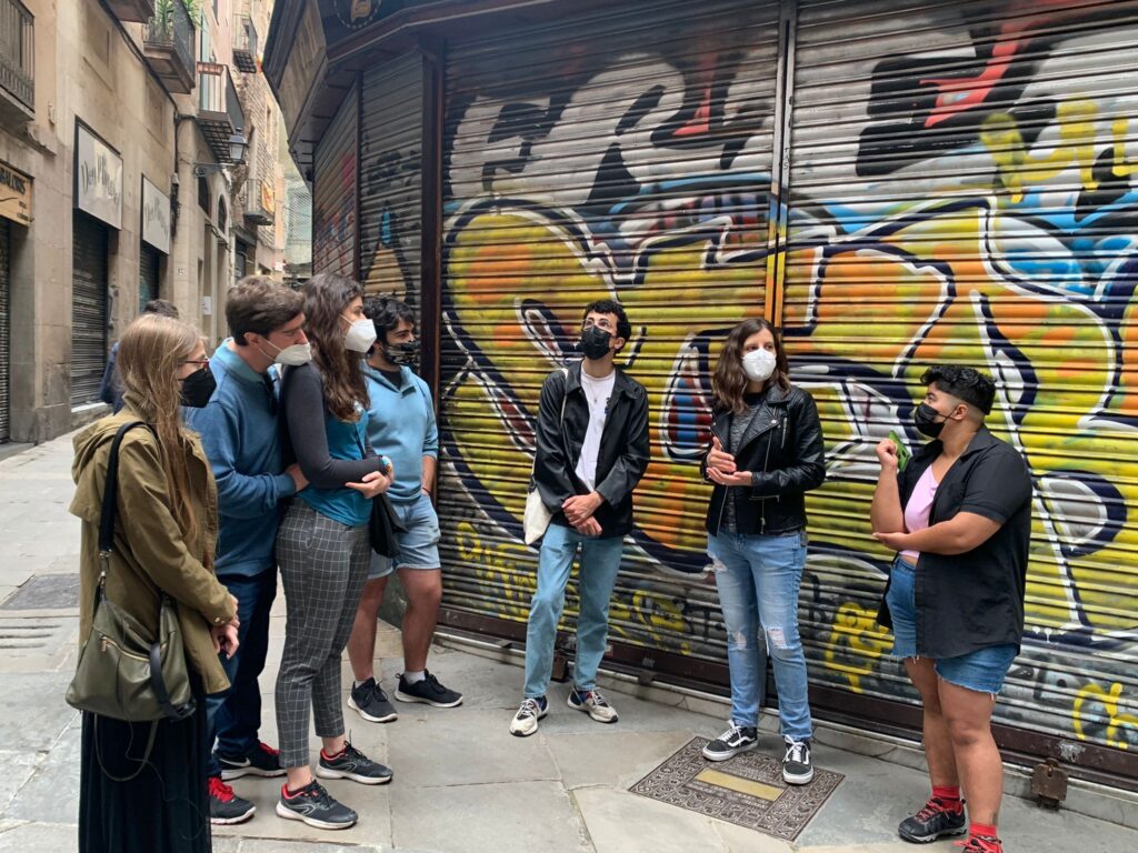 Young adults gather for tour of old Jewish Quarters in Barcelona Spain