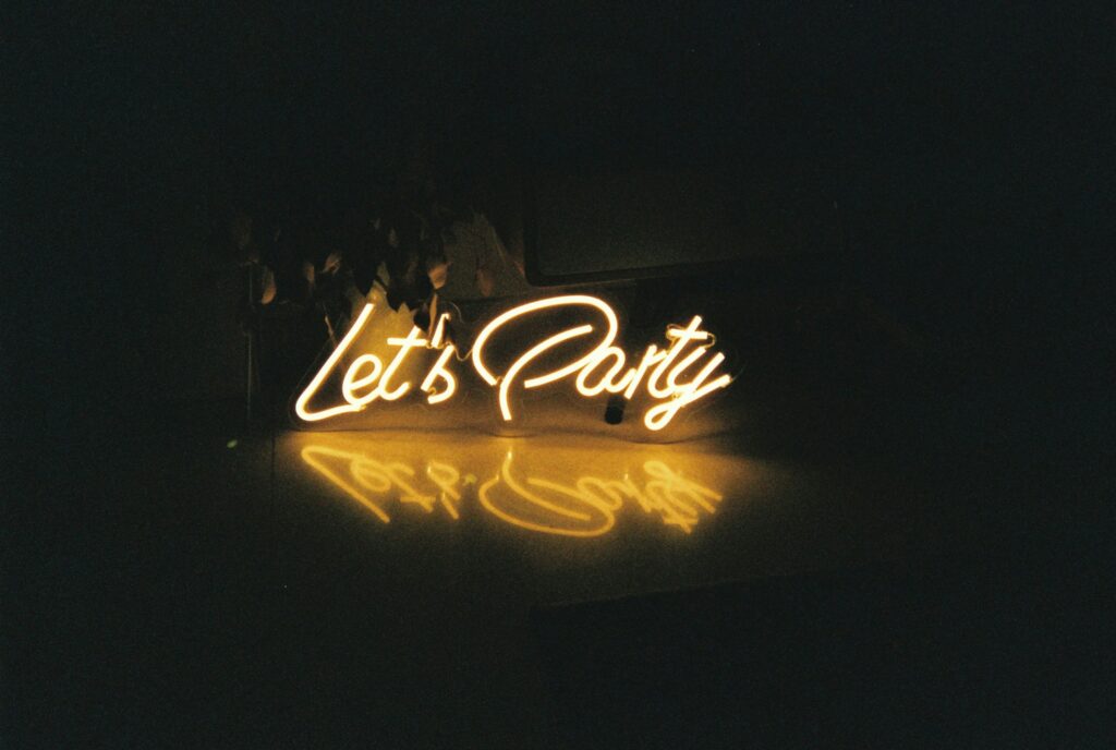 A sign that says Let's Party